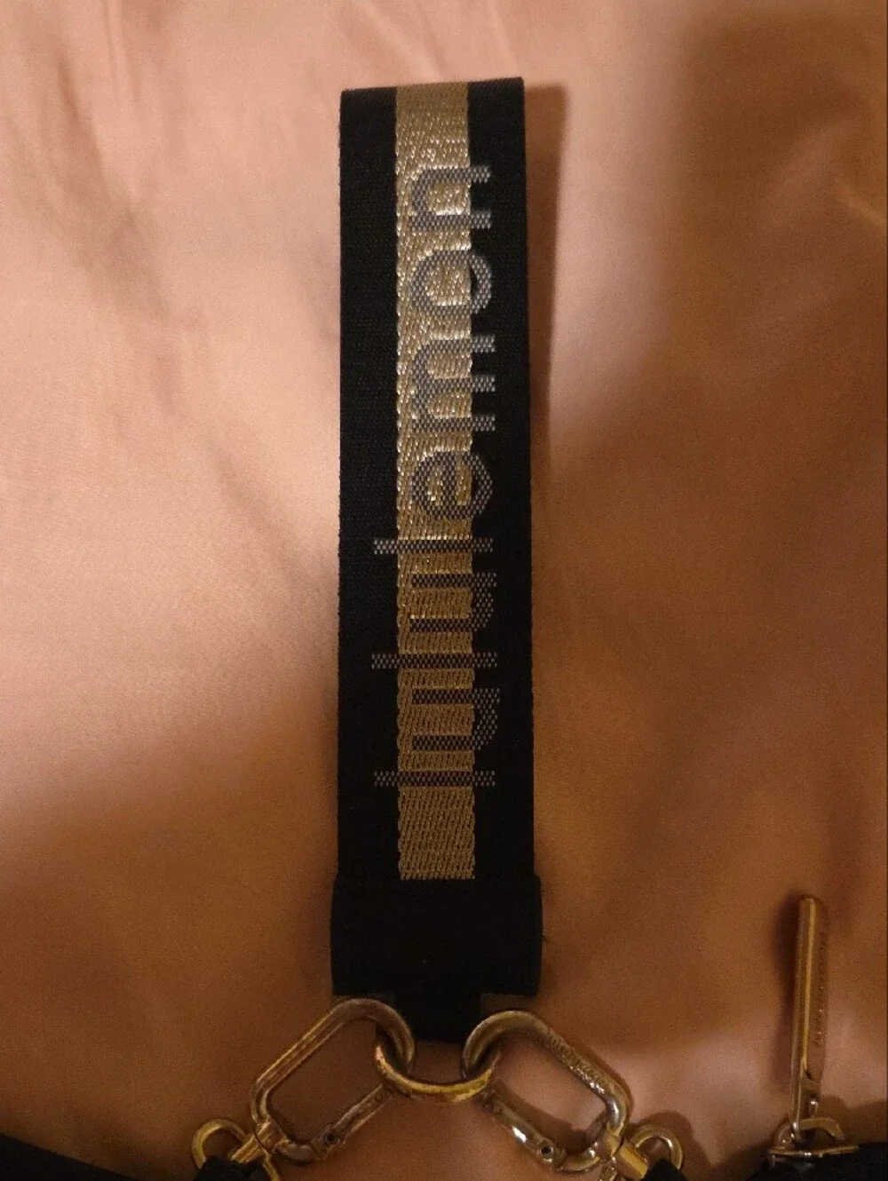 lululemon athletica Black Mini Wristlet Pouches with Gold Accent Strap